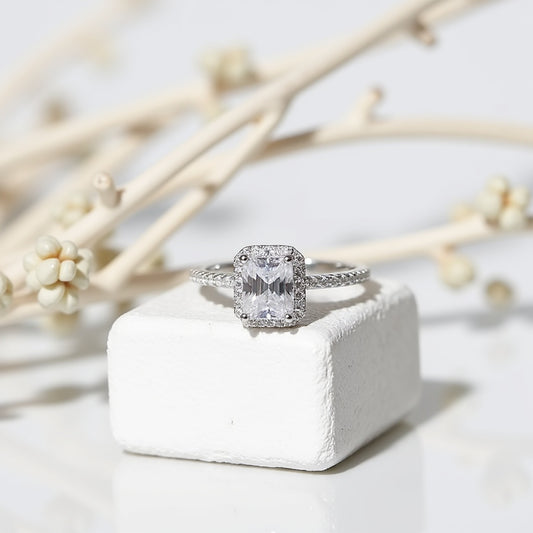 1. Radiant Cut Moissanite Ring with diamond encrusted band